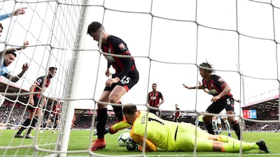 Boruc and Jack Simpson in action. Reuters