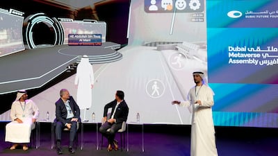 Khalifa AlJaziri, the UAE Ministry of Economy's metaverse lead, demonstrating the ministry's new metaverse headquarters at the Dubai Metaverse Assembly on Wednesday. AP