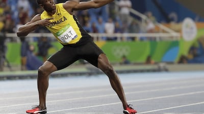 Usain Bolt from Jamaica celebrates winning the gold medal in the men's 200-meter final during the athletics competitions of the 2016 Summer Olympics at the Olympic stadium in Rio de Janeiro, Brazil, on Thursday. (AP)