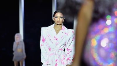 Christian Cowan went with a deep purple for several creations and lavender for others worthy of a night out, including an embellished body hugger with one bulbous shoulder. AFP