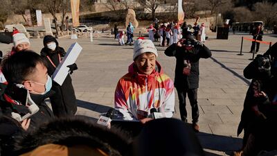 Chan speaks to media after carrying the torch on the second day of its journey to Friday's Opening Ceremony. AFP