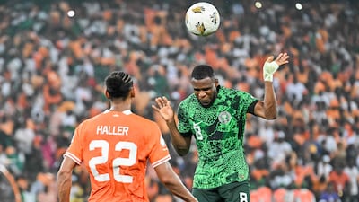 Nigeria midfielder Frank Onyeka, right, heads the ball during the final. AFP
