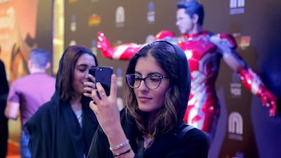 A woman takes a selfie in Riyadh Park Mall, in Saudi Arabia. Mobile operators were fined in part for disregarding instructions in dealing with customer complaints. EPA