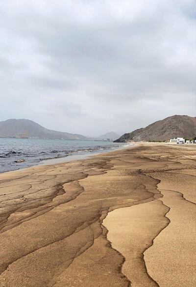 Oil washes ashore along a beach in Khor Fakkan in late June. Courtesy: Khor Fakkan Municipality