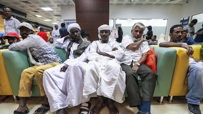 Residents who have been trying to take advantage of the amnesty wait patiently at the Tasheel Centre in Abu Dhabi. Victor Besa/The National