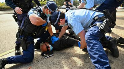 Police arrest a man during an anti-lockdown protest in Sydney. Despite a series of lockdowns and an economic downturn, the city ranks highly for its resilience and handling of the pandemic. AAP via AP