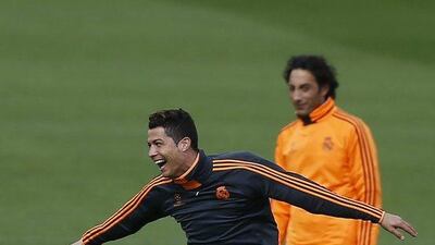 Cristiano Ronaldo jokes around during Real Madrid's training session on Tuesday. Andres Kudacki / AP / April 1, 2014