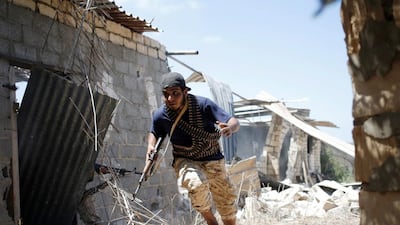 A fighter of Libyan forces allied with the U.N.-backed government runs for cover during a battle with ISIL fighters in Sirte, Libya, July 31, 2016. Goran Tomasevic / Reuters