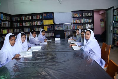 Higher secondary school students study in the main library of Aabroo School. Imran Mukhtar for The National