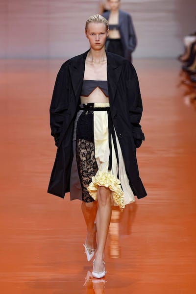 Bookish grey, heavy lace and ruffles of lemony-yellow make up with skirt at Prada. Photo: Prada