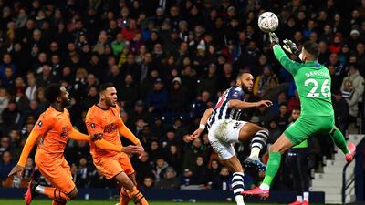 Newcastle United goalkeeper Karl Darlow saves a chance from West Bromwich Albion's Matt Phillips. AFP