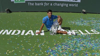 Novak Djokovic, of Serbia, poses on the court after defeating Milos Raonic, of Canada, in a final at the BNP Paribas Open tennis tournament, Sunday, March 20, 2016, in Indian Wells, Calif. Djokovic won 6-2, 6-0. AP Photo/Mark J. Terrill)