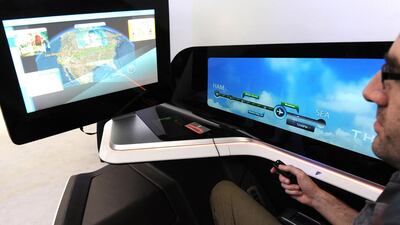 A visitor tries out French manufacturer Thales' prototype for the next generation of business class seat, which includes iris-tracking to tell when passengers are looking away, at the International Paris Airshow at Le Bourget on June 17, 2015. Eric Piermont / AFP