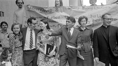 Eqbal Ahmad, third from right, gestures as he leaves the Federal Building, Washington, DC, in May 1971, as part of the Harrisburg Seven, a group of anti-war activists unsuccessfully prosecuted for allegedly plotting to kidnap Henry Kissinger, US president Richard Nixon's national security advisor. Bettmann / Corbis