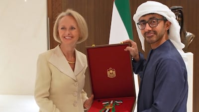 Sheikh Abdullah bin Zayed, Deputy Prime Minister and Minister of Foreign Affairs, bestows the First Class Order of Zayed II on US ambassador Martina Strong
