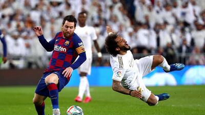 Barcelona's Lionel Messi reacts after fouling Real Madrid defender Marcelo. Reuters
