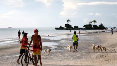 People frolic at the beach.