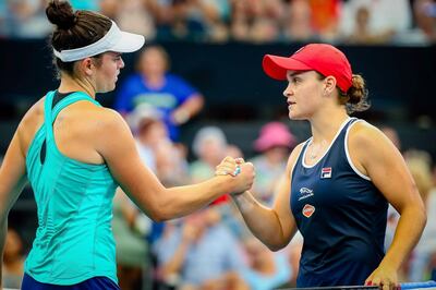 Jennifer Brady, left, and Ashleigh Barty greet each other at the net after their second round match at the Brisbane International. AFP