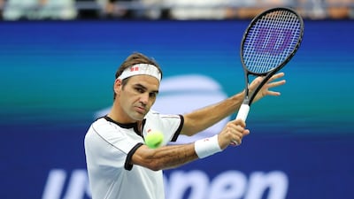 Roger Federer returns a shot during his second round match against Damir Dzumhur. AFP