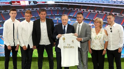Eden Hazard poses for photos with Real Madrid president Florentino Perez and his family. Getty Images