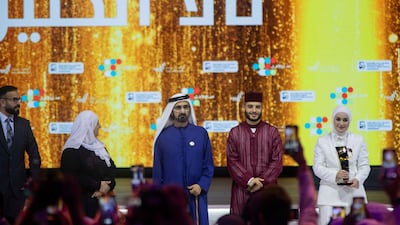 Sheikh Mohammed with the four winners, from left, Mohamed Al Najjar from Iraq, Fathiya Al Mahmoud from Egypt, Moroccan YouTuber Amine Imnir, and Tala Al Khalil from Iraq,