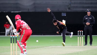 Semo Kamea of Papua New Guinea bowls against Oman.