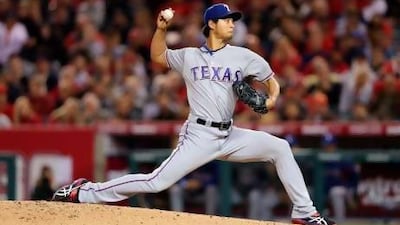ANAHEIM, CA - APRIL 24: Yu Darvish #11 of the Texas Rangers pitches against the Los Angeles Angels of Anaheim in the second inning at Angel Stadium of Anaheim on April 24, 2013 in Anaheim, California. Jeff Gross/Getty Images/AFP== FOR NEWSPAPERS, INTERNET, TELCOS & TELEVISION USE ONLY == *** Local Caption *** 985427-01-09.jpg