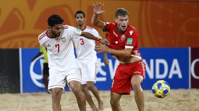 Aleh Hapon of Belarus is challenged by Hesham Muntaser of UAE during the FIFA Beach Soccer World Cup in Paraguay. Getty