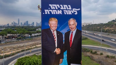 An election campaign billboard for the Likud party showing US President Donald Trump and Israeli Prime Minister Benjamin Netanyahu in Tel Aviv, in 2019. AP