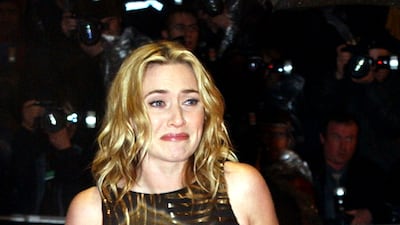 Kate Winslet, in a gold sequin-trimmed dress, arrives for the Baftas on February 24, 2002 in London, England. Getty Images