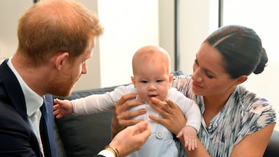Prince Harry and Meghan Markle with their son Archie, while meeting Archbishop Desmond Tutu at the Desmond & Leah Tutu Legacy Foundation in Cape Town, South Africa, in September 2019. Reuters