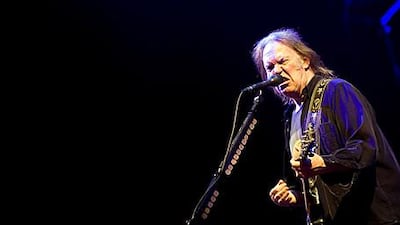 Neil Young performs during the headline slot on the Pyramid stage at the Glastonbury festival last year.