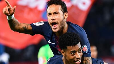 Paris Saint-Germain's Brazilian forward Neymar celebrates with teammate Presnel Kimpembe. AFP