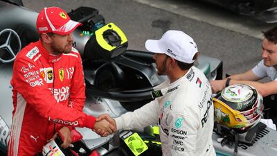 Lewis Hamilton, right, and Sebastian Vettel will start on the front row for the first time since Belgium. Reuters