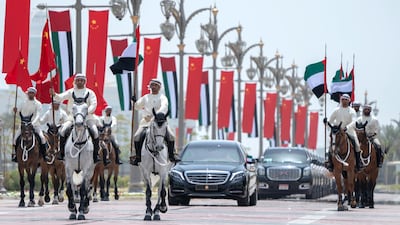 Members of the UAE Armed Forces Cavalry Division escort Mr Xi's motorcade towards the palace entrance. Crown Prince Court - Abu Dhabi