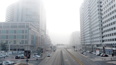 Residents woke up in Abu Dhabi on Saturday morning to find the city shrouded by dense fog. Seen here is Abu Dhabi Mall in the Tourist Club Area. Deepthi Unnikrishnan / The National