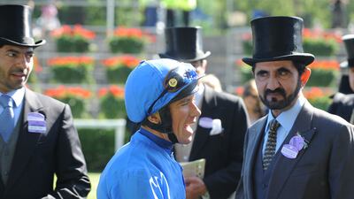 Royal Hunt Cup-winning jockey Frankie Dettori alongside Godolphin owner Sheikh Mohammed bin Rashid Al Maktoum after Dettori rode Godolphin horse Invisible Man to victory on Day 2 of Royal Ascot on June 16, 2010. Shutterstock