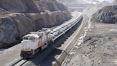 An Etihad Rail train carries the first consignment of cars to be transported by rail in the UAE. Photo: Al Masaood Automobiles