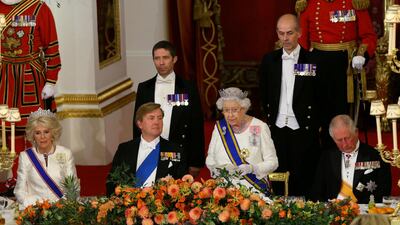 Queen Elizabeth II gives a speech as Camilla, Duchess of Cornwall, King Willem-Alexander of the Netherlands and Charles, Prince of Wales listen during a state banquet at the Buckingham Palace in London. Yui Mok / Reuters