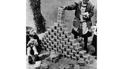 Children using bank notes as building blocks during German's inflation crisis.