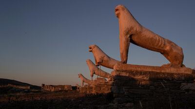 The guardian Lions dedicated by the Naxians to the Sanctuary of ancient Greek God Apollo on 7th century BC, are lighted with the first morning light, in the ancient island of Delos, Greece , on Wednesday, May 12, 2021. AP Photo/Petros Giannakouris