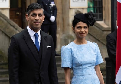 Prime Minister Rishi Sunak and his wife Akshata Murty outside Westminster Abbey. AFP
