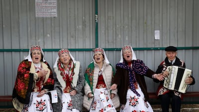 Women wearing Belarusian national dress sing a song as they take part in a national festival marking the end of harvest collection in Smolevichi, 30 km east of the capital Minsk. Sergei Grits / AP Photo