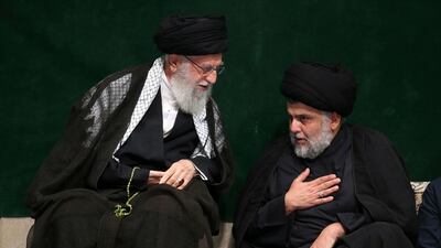 Iran's Supreme Leader Ayatollah Ali Khamenei, left, greets Iraqi Shiite cleric Moqtada Al Sadr during a mourning ceremony commemorating Ashura, in Tehran, Iran in 2019. AP