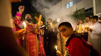 St Stephen’s Syrian Orthodox congregation Christmas Eve prayers at St Andrew’s Church in Abu Dhabi. Christopher Pike / The National