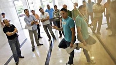 Michael Aldendorff, far right, prompts other Discovery Gardens tenants and homeowners to come up with measures to get Nakheel to fix outstanding structural problems in the Mediterranean Cluster yesterday.