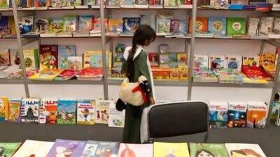 A pupil from the Hajar Girls School in Al Ain at the Al Ain Reads book show.