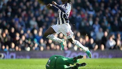 WEST BROMWICH, ENGLAND - JANUARY 01: Romelu Lukaku of West Bromwich Albion is tackled by David Stockdale of Fulham during the Barclays Premier League match between West Bromwich Albion and Fulham at The Hawthorns, on January 1, 2013 in West Bromwich, England. (Photo by Clive Mason/Getty Images) *** Local Caption *** 158852614.jpg