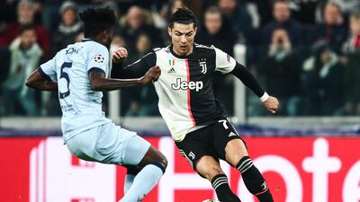 Ronaldo challenges Atletico Madrid's Ghanaian midfielder Thomas. AFP