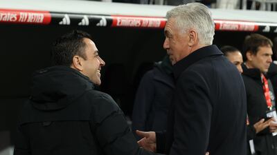 Barcelona coach Xavi, left, knows victory against Real Madrid rival Carlo Ancelotti in the clasico on Sunday will go a long way to sealing La Liga title. EPA
